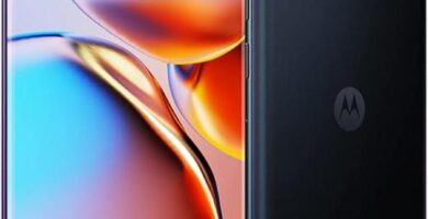 The image showcases the Motorola Edge+ smartphone, highlighting its sleek and modern design. The phone features a large, edge-to-edge display with minimal bezels, emphasizing its cutting-edge aesthetic. The back of the device appears to be composed of premium materials,