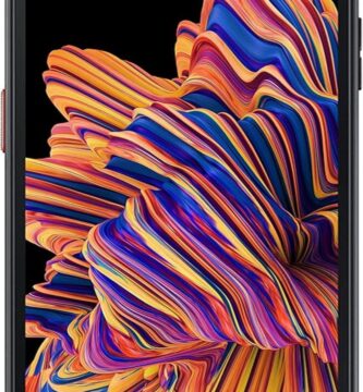 An image of the Samsung Galaxy XCover Pro smartphone. The phone features a rugged design, emphasizing durability and robustness. It's displayed standing upright, showcasing its textured back for grip and protective edges. The screen is on, displaying a vibrant home screen with various