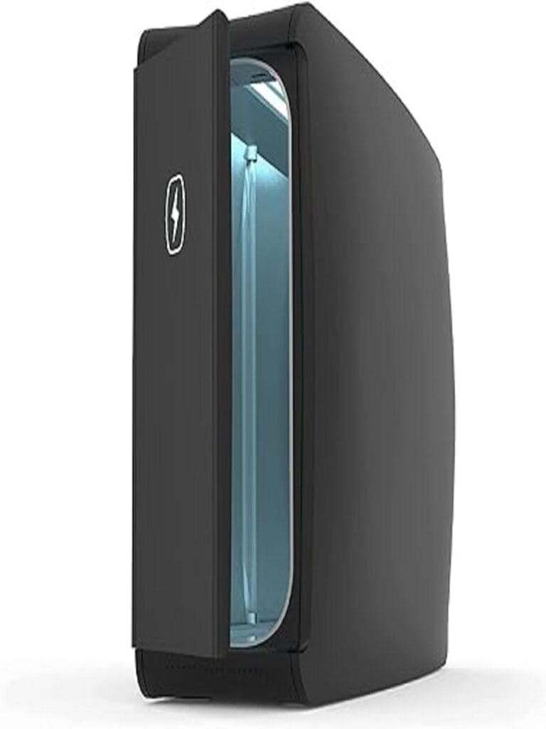 The image shows the PhoneSoap XL, a large UV sanitizer designed to enhance hygiene by thoroughly disinfecting personal items. The product features a sleek, modern design with a rectangular compartment that can accommodate multiple devices or larger items. The UV light mechanism is highlighted, emphasizing its capability to kill germs effectively. The PhoneSoap XL is showcased in a clean, minimalist setting, reflecting its purpose in promoting cleanliness and health.
