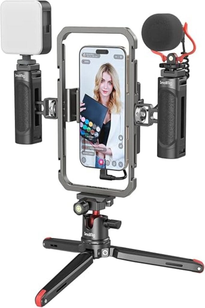 The image showcases the SmallRig Universal Phone Video Rig Kit, designed for vloggers. The product consists of a robust cage that securely holds a smartphone in landscape orientation. It features ergonomic handgrips on both sides for stable shooting. On top, there