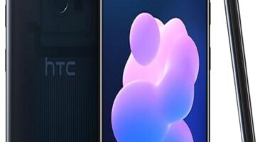 The image features the HTC U12+ smartphone. It showcases the sleek design of the phone with its shiny, reflective body and edge-to-edge display. The smartphone is positioned at an angle to highlight its slim profile and advanced features. The phone screen displays