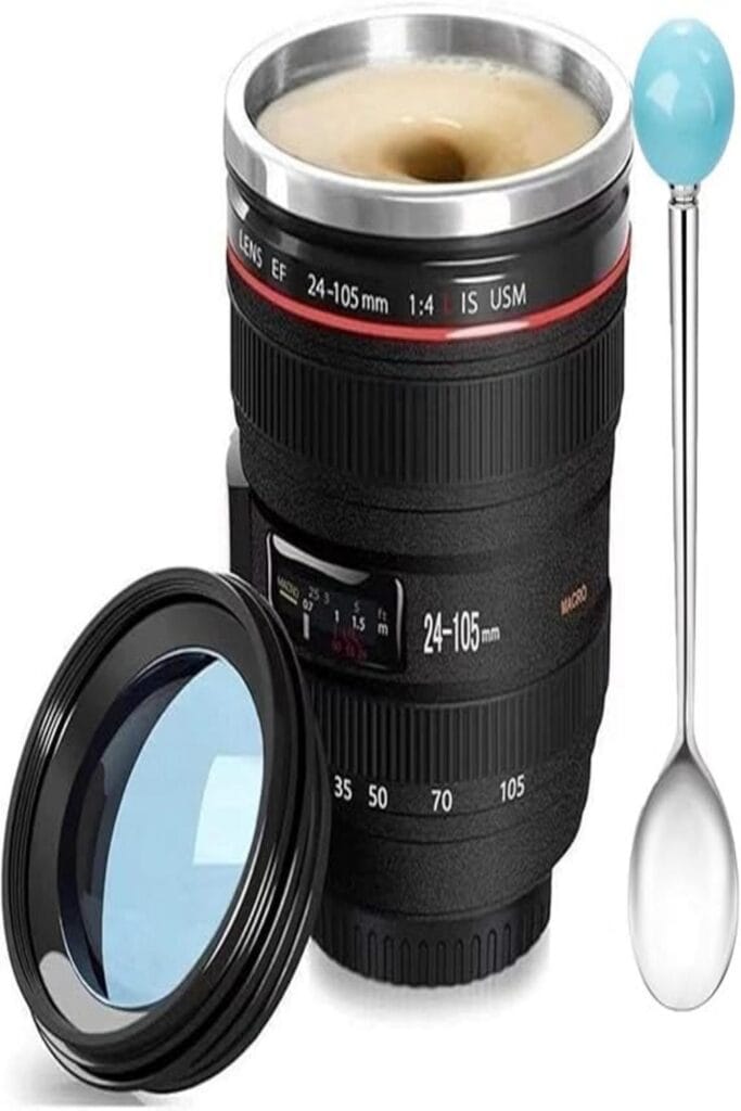 Camera lens-shaped coffee mug on a table, perfect for photography enthusiasts.