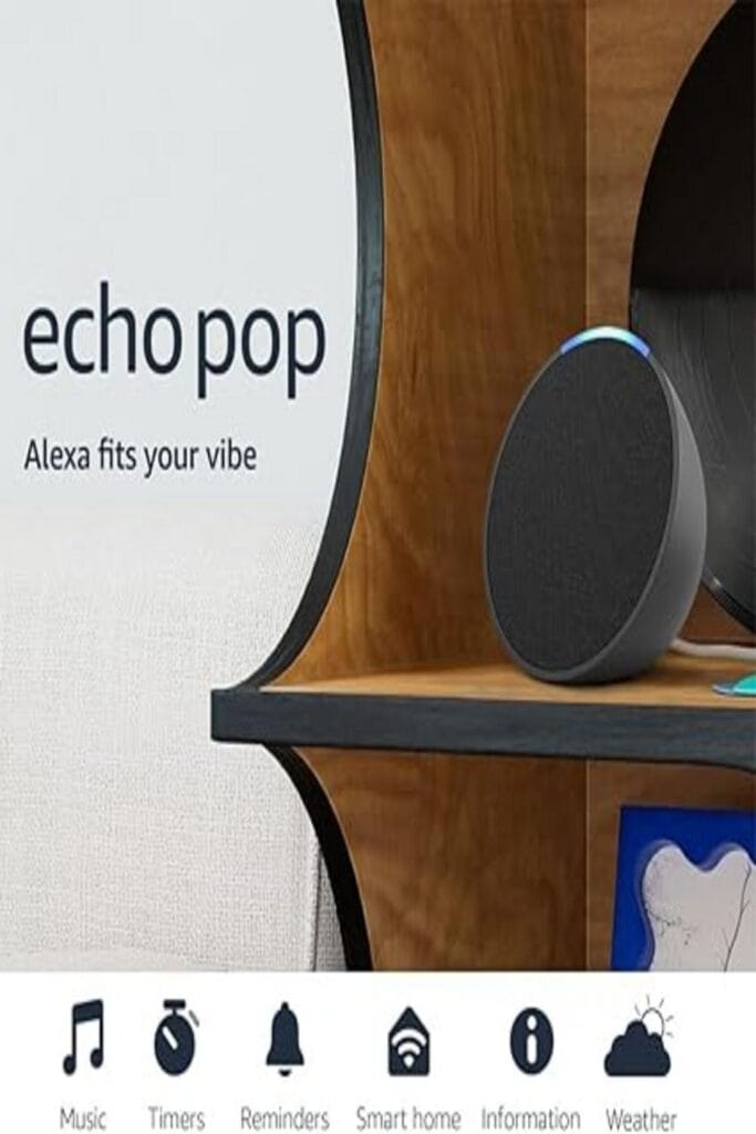 The image shows the Amazon Echo Pop, a compact version of Alexa-enabled devices. The device features a small, round shape with a smooth, minimalist design. It is available in a variety of colors and appears to have a mesh fabric covering most of its