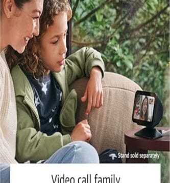 Echo Show 5 (3rd Gen) on a table, with a colorful display and sleek black design.