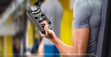 Hand squeezing HICHOR Dynamometer showcasing grip strength measurement display.