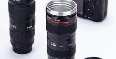 Camera lens mug with lid, realistic design; ideal quirky gift for photography lovers.