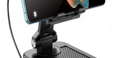 "TechGlow Foldable Stand displayed elegantly on a desk with colorful ambient lighting."