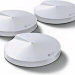 TP-Link Deco M5 routers enhancing Wi-Fi coverage in a home setting.