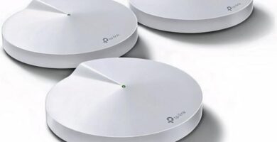 TP-Link Deco M5 routers enhancing Wi-Fi coverage in a home setting.