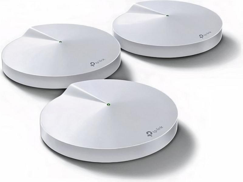 TP-Link Deco M5 routers enhancing Wi-Fi coverage in a home setting.