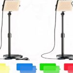 A glowing light bulb illuminates a video camera against a dark background.